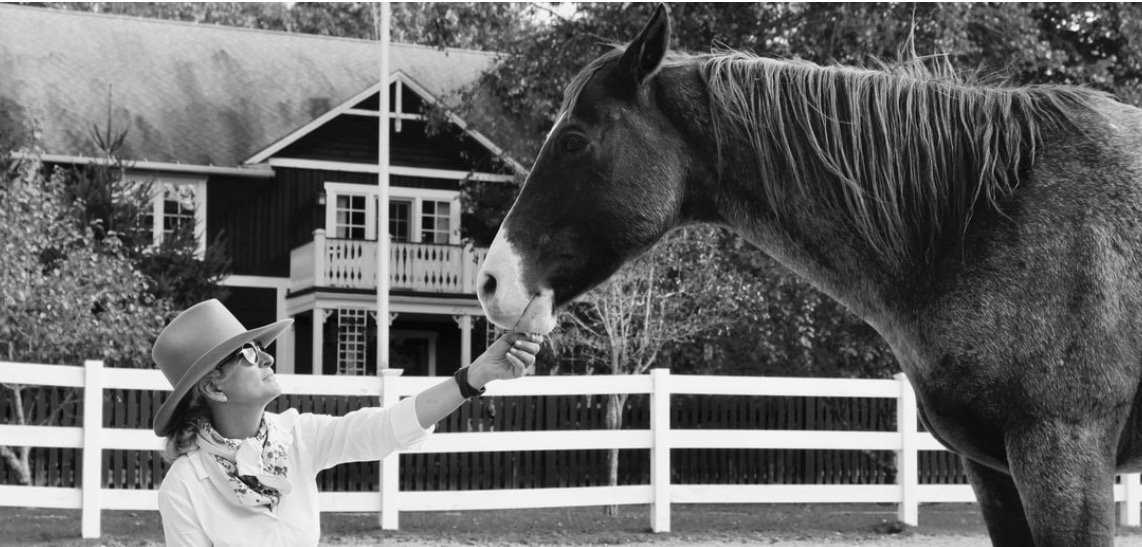 Karin Yapalater with a horse at the farm
